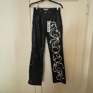 I am Gia black leather pants with white paint lace
